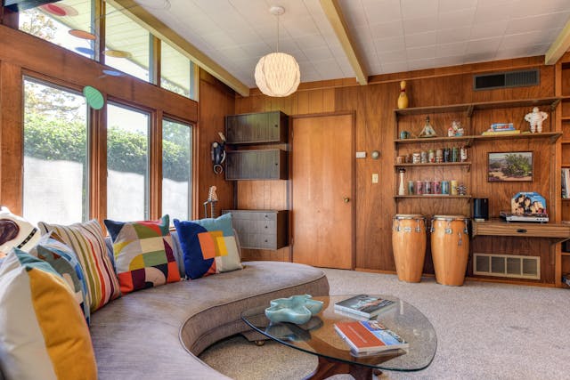 Brown Walls in Room with Windows and Couch